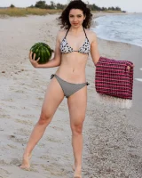 Pretty brunette teen is on the beach in grey bikini with watermelon, she strips her remarkable perfect puffy nipples body