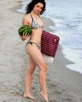 Pretty brunette teen is on the beach in grey bikini with watermelon, she strips her remarkable perfect puffy nipples body