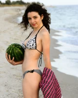 Pretty brunette teen is on the beach in grey bikini with watermelon, she strips her remarkable perfect puffy nipples body