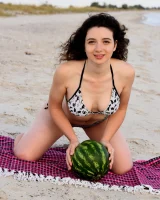 Pretty brunette teen is on the beach in grey bikini with watermelon, she strips her remarkable perfect puffy nipples body
