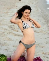 Pretty brunette teen is on the beach in grey bikini with watermelon, she strips her remarkable perfect puffy nipples body