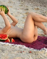 Pretty brunette teen is on the beach in grey bikini with watermelon, she strips her remarkable perfect puffy nipples body