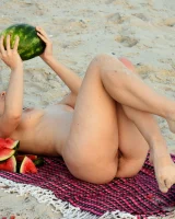 Pretty brunette teen is on the beach in grey bikini with watermelon, she strips her remarkable perfect puffy nipples body