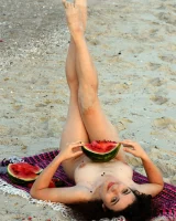 Pretty brunette teen is on the beach in grey bikini with watermelon, she strips her remarkable perfect puffy nipples body