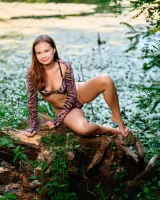 Puffy nipples goddess in motley bikini goes nude to swim lakeside