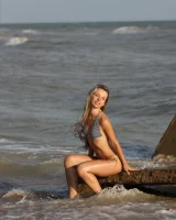 Exciting baby in bikini in cold water going nude and got puffy nipples