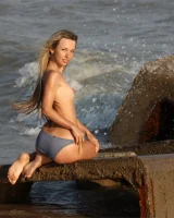 Exciting baby in bikini in cold water going nude and got puffy nipples
