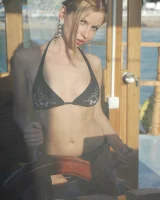 Sexy puffy nipples lady in black bikini is nude on the big boat