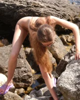 Sexy teen in bikini and glasses going nude at the beach shore to show her amazing hairy pussy body