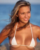 Hairy pussy blonde with perfect body is on the beach in micro bikini