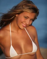 Hairy pussy blonde with perfect body is on the beach in micro bikini