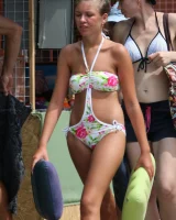 Candid girls in bikini walking on the beach