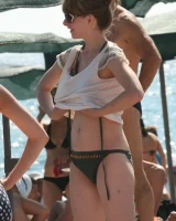 Candid girls in bikini walking on the beach