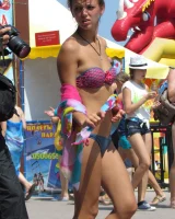 Candid girls in bikini walking on the beach