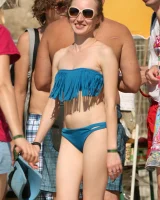 Candid girls in bikini walking on the beach