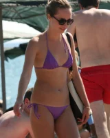 Candid girls in bikini walking on the beach