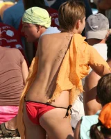 Candid girls in bikini walking on the beach