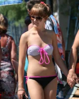 Amazing girls in sexy bikinis are walking at the streets