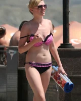 Amazing girls in sexy bikinis are walking at the streets