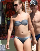 Amazing girls in sexy bikinis are walking at the streets