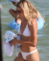 Amazing girls in sexy bikinis are walking at the streets