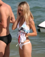 Amazing girls in sexy bikinis are walking at the streets