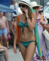 Amazing girls in sexy bikinis are walking at the streets