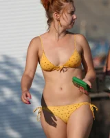 Amazing girls in sexy bikinis are walking at the streets