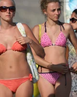 Amazing girls in sexy bikinis are walking at the streets