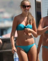 Amazing girls in sexy bikinis are walking at the streets