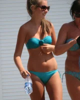 Amazing girls in sexy bikinis are walking at the streets