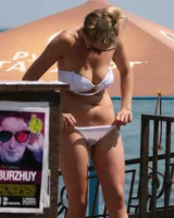 Amazing girls in sexy bikinis are walking at the streets