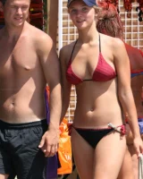 Candid girl on the beach and walking nearby in sexy bikinis