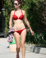 Candid girl on the beach and walking nearby in sexy bikinis