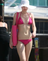 Candid girl on the beach and walking nearby in sexy bikinis