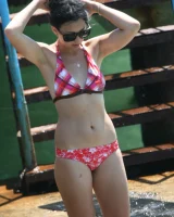 Candid girl on the beach and walking nearby in sexy bikinis