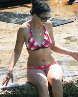 Candid girl on the beach and walking nearby in sexy bikinis