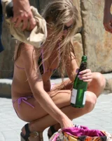 Candid girl on the beach and walking nearby in sexy bikinis