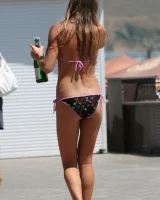 Candid girl on the beach and walking nearby in sexy bikinis