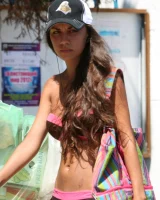 Candid girl on the beach and walking nearby in sexy bikinis