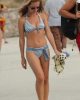 Beautiful hot young goddesses walking in bikini