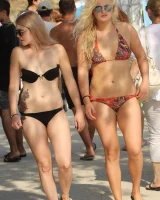 Beautiful hot young goddesses walking in bikini