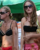 Beach dancing candid girls in sexy bikinis