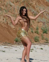 Sexy brunette hottie in pink bikini on the beach