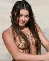 Sexy brunette hottie in pink bikini on the beach