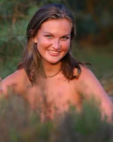 Sexy hottie in black bikini in the forest