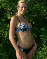 Girl with tasty ass in bikini topless in the field