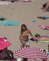 Hot candid babes in bikinis playing beach volleyball