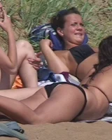 Hot candid babes in bikinis playing beach volleyball