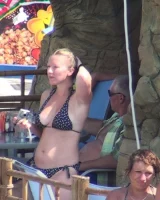 Candid chicks walking on the beach in sexy bikinis